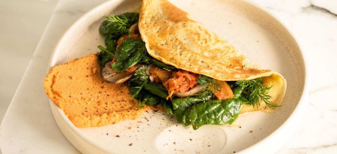 image-of-an-freshly-cooked-omlette-with-greens-on-a-plate